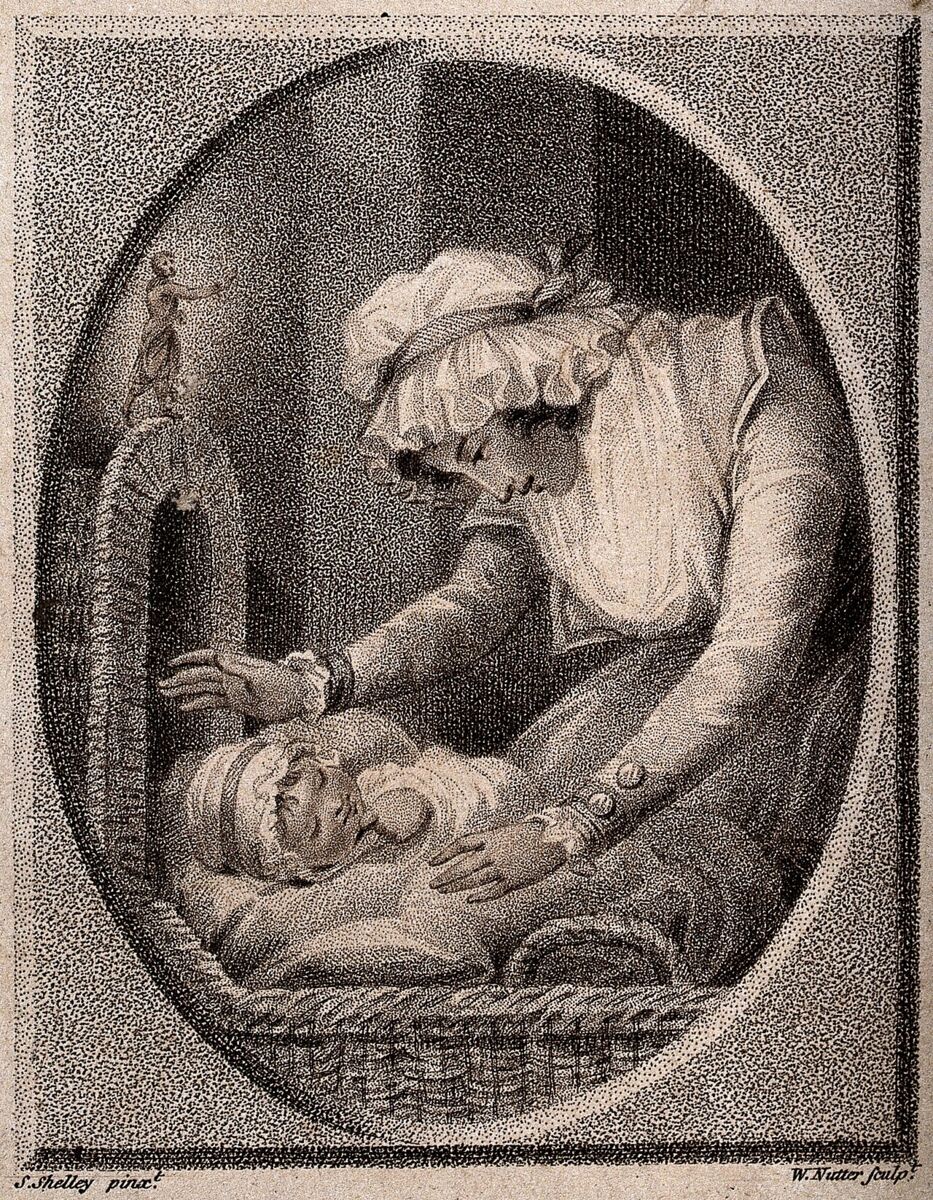 A baby sleeping safely on its back in a cot