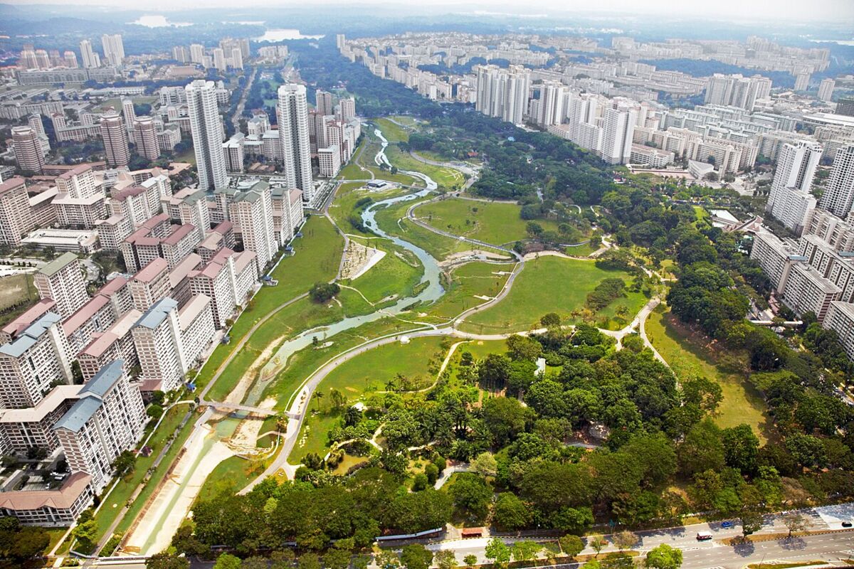 Aerial view of Bishan-Ang Mo Kio Park showing the winding river and expansive green space surrounded by housing estates