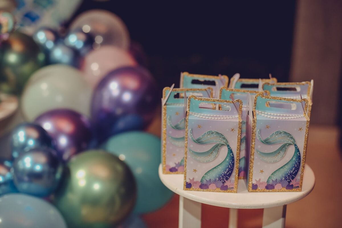 Vibrant gift boxes and balloons for festive celebrations.