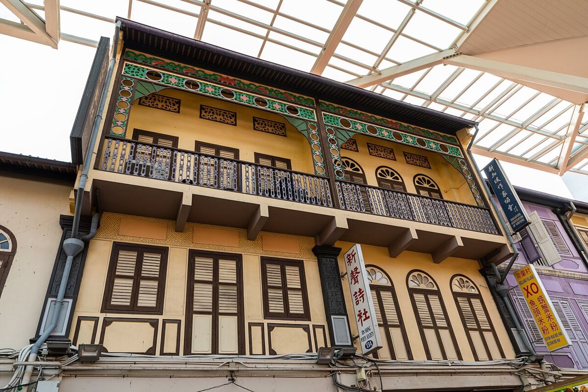 Ornate restored shophouse with a decorated balcony on Smith Street in Chinatown Singapore