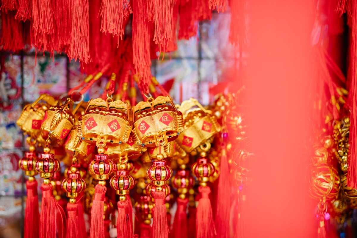 Collection of red and golden Chinese hanging decorations with hieroglyphs for New Year celebration