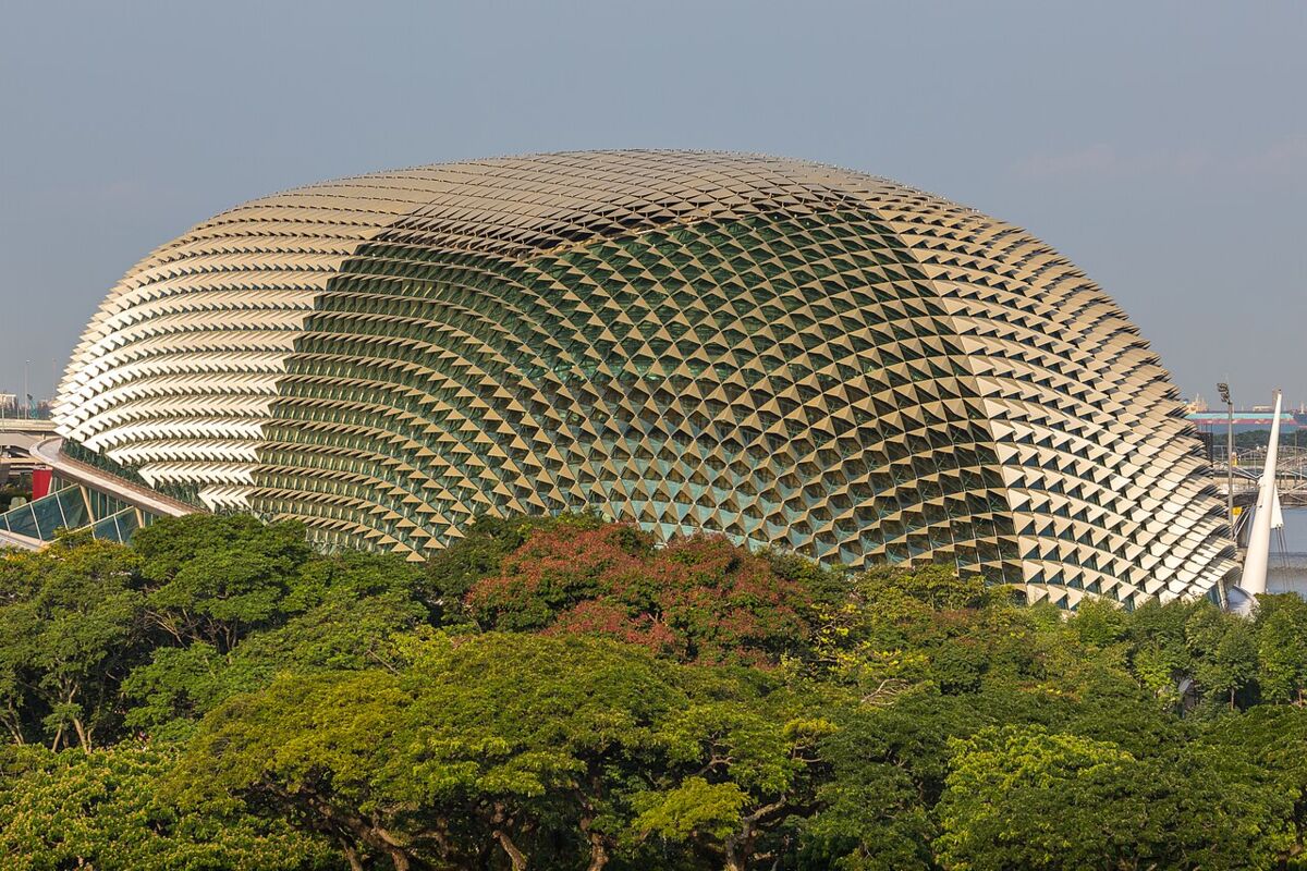 Close-up of the spiked aluminium-shaded dome roof of the Esplanade rising above lush tropical trees