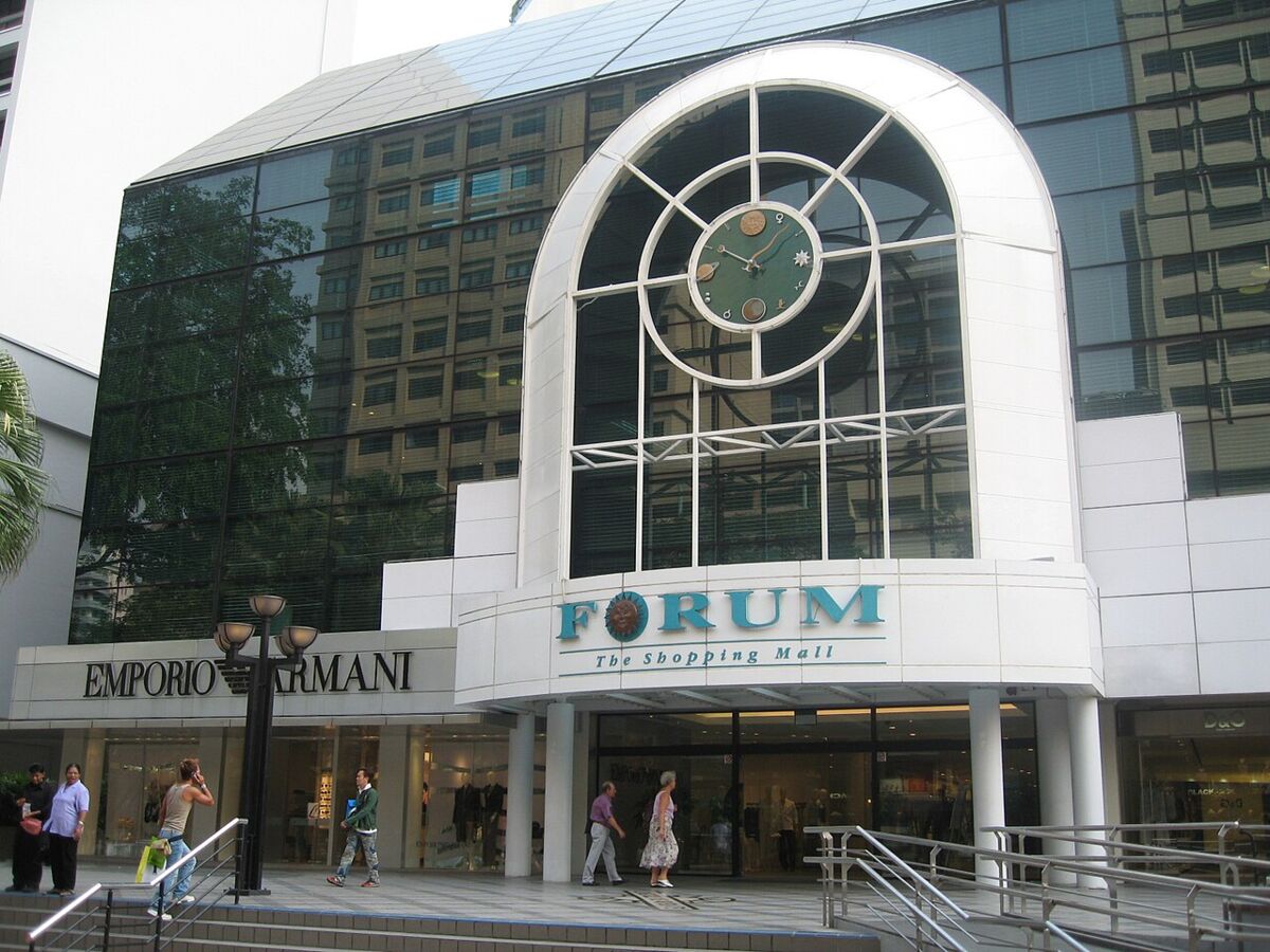 Main entrance of Forum The Shopping Mall featuring the arched clock facade and Forum signage