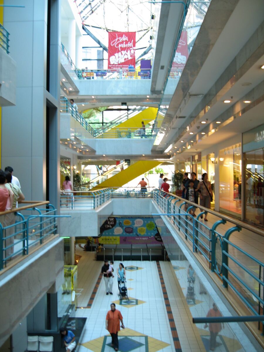Interior atrium of Forum The Shopping Mall showing multiple levels, escalators and shoppers