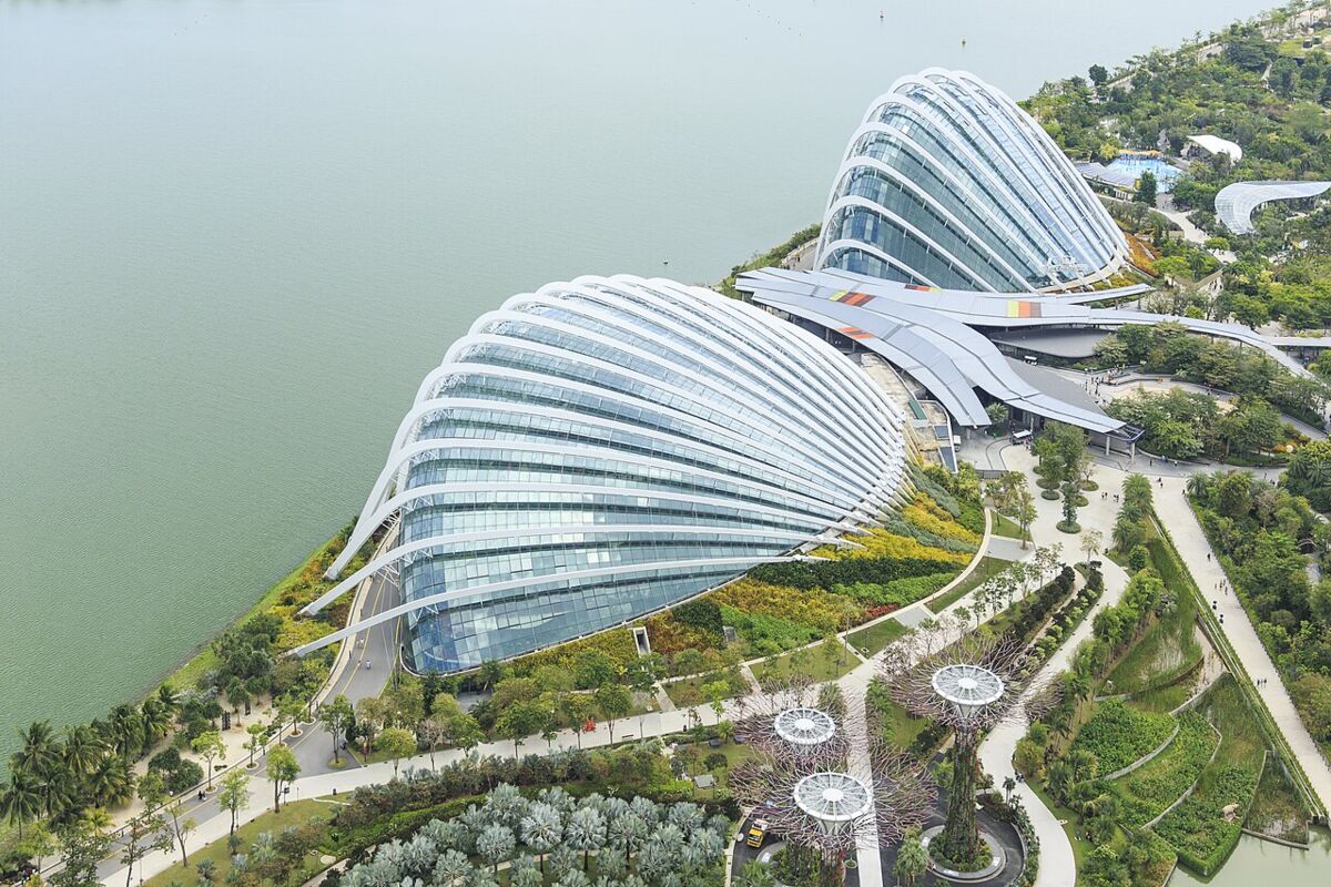 Aerial view of the two glass conservatory domes, Flower Dome and Cloud Forest, beside the water