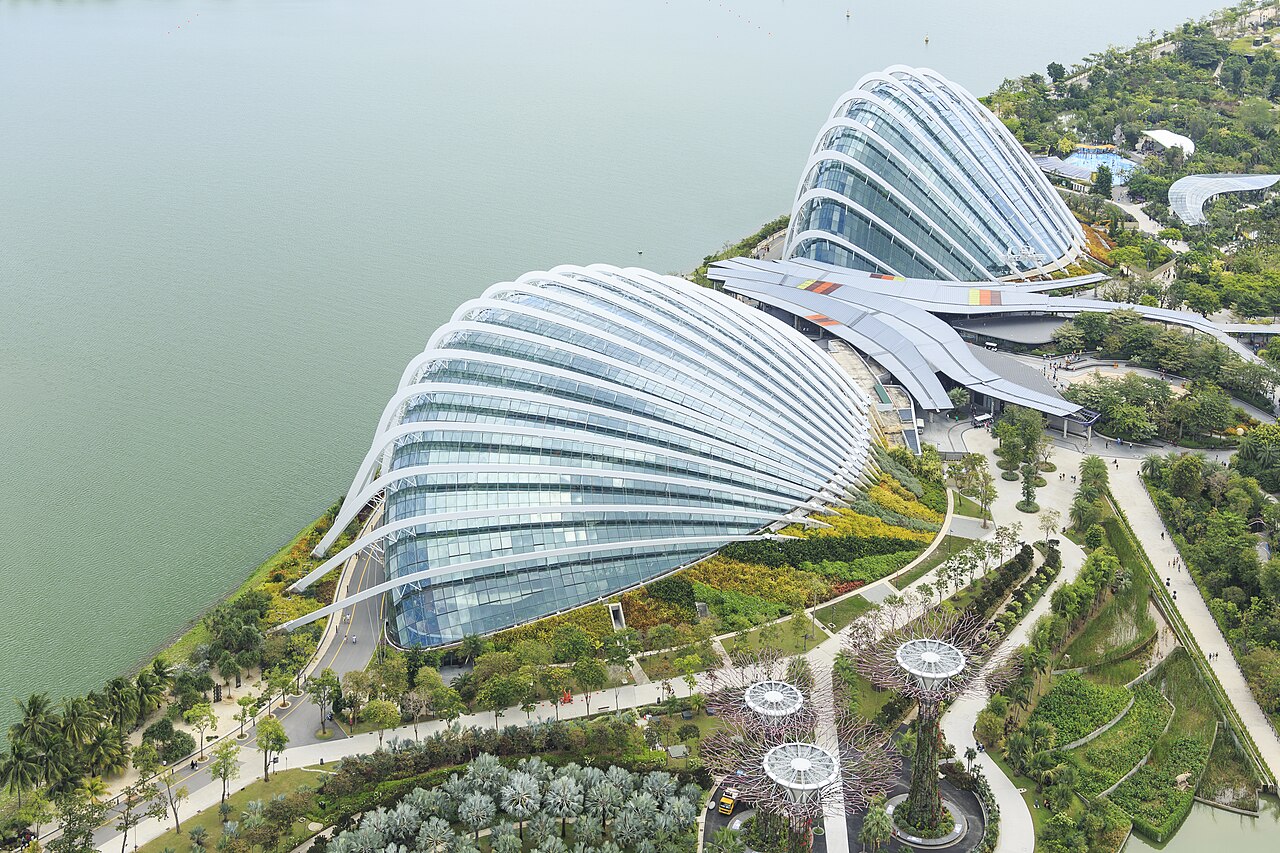 Aerial view of the two glass conservatory domes, Flower Dome and Cloud Forest, beside the water
