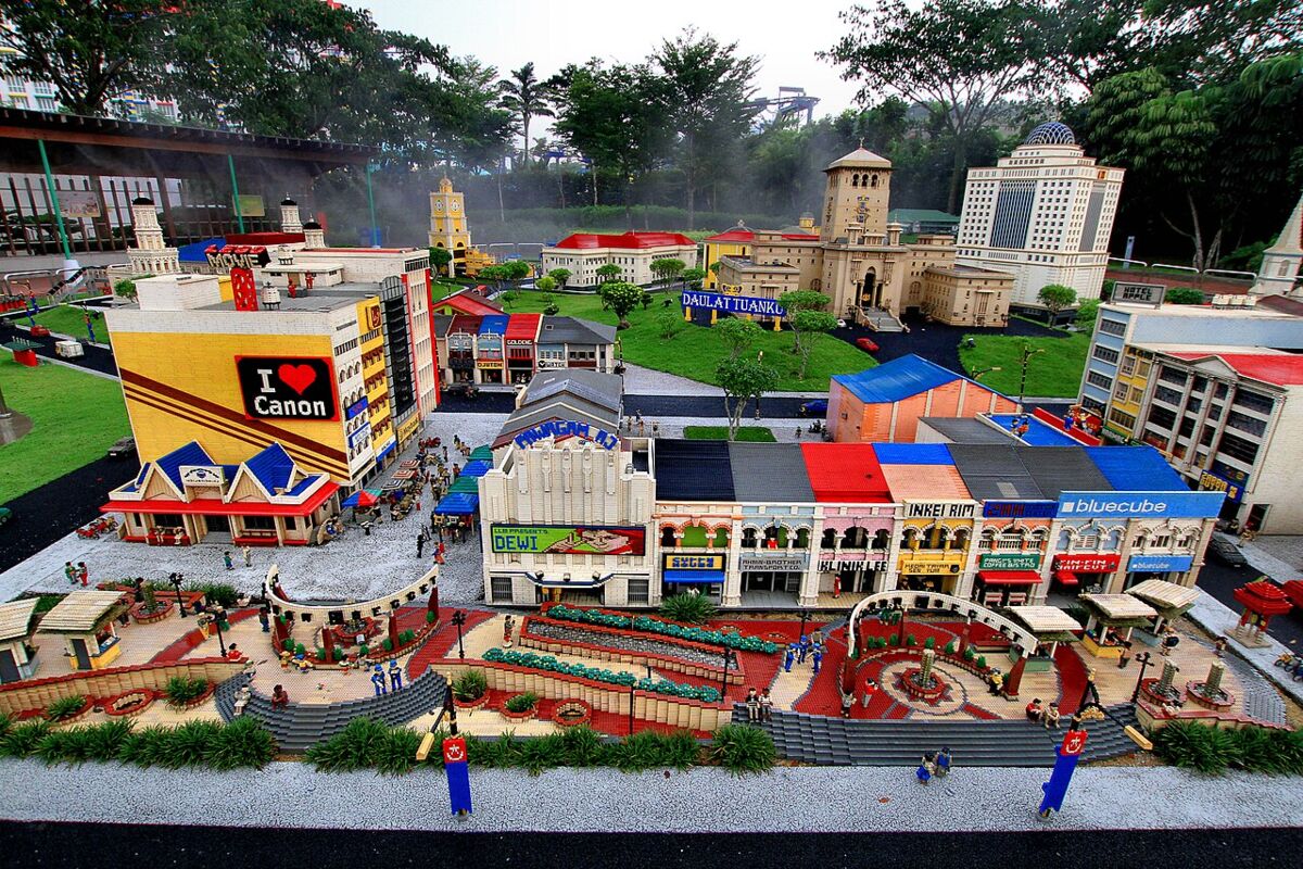 Detailed Lego Miniland scale model of a Malaysian city street with shops and tiny figures at Legoland Malaysia