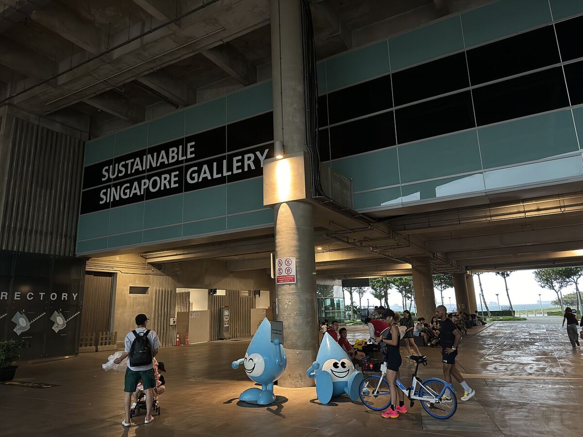 Entrance to the Sustainable Singapore Gallery at Marina Barrage with visitors and the blue water-drop mascots