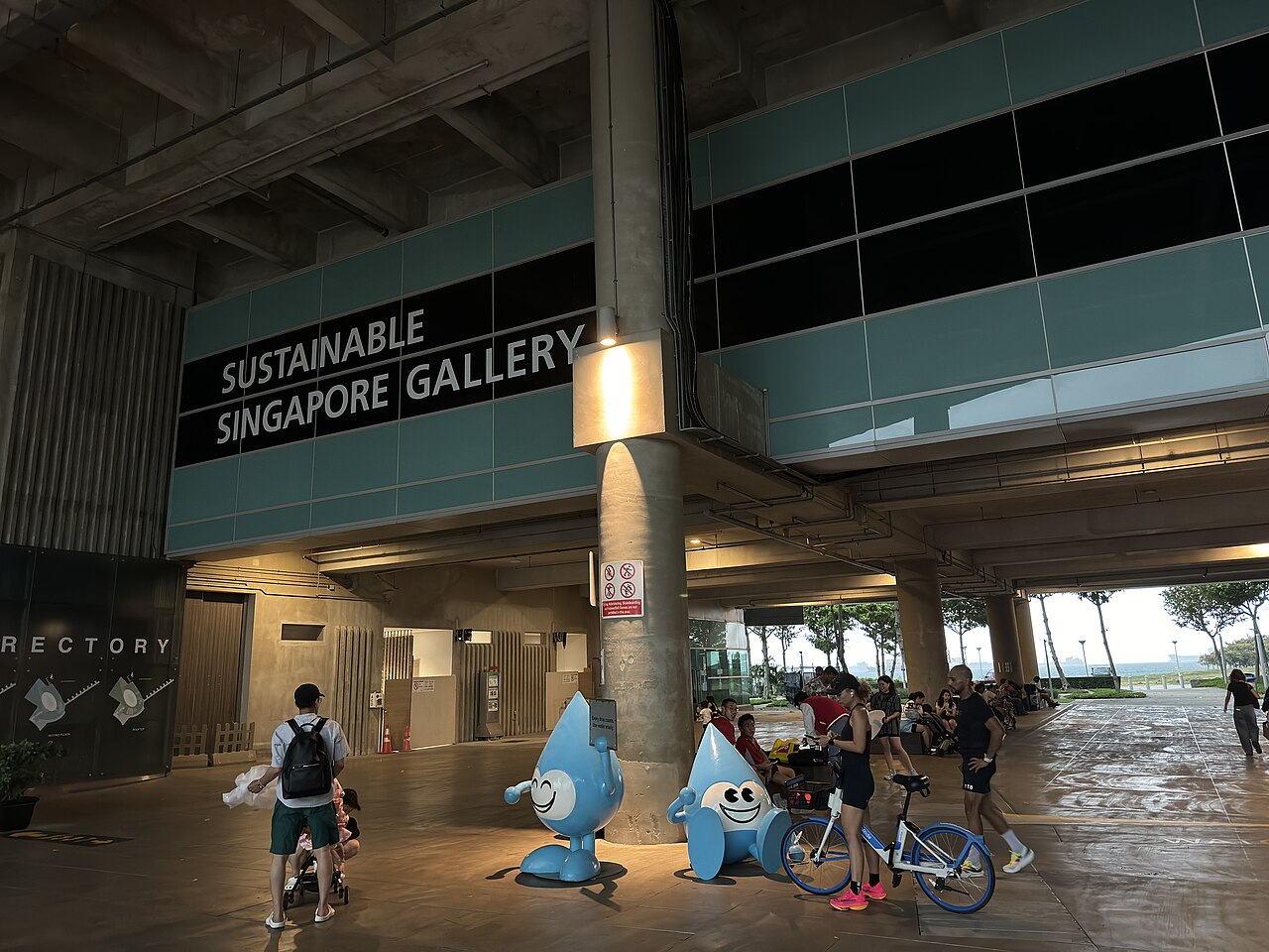 Entrance to the Sustainable Singapore Gallery at Marina Barrage with visitors and the blue water-drop mascots