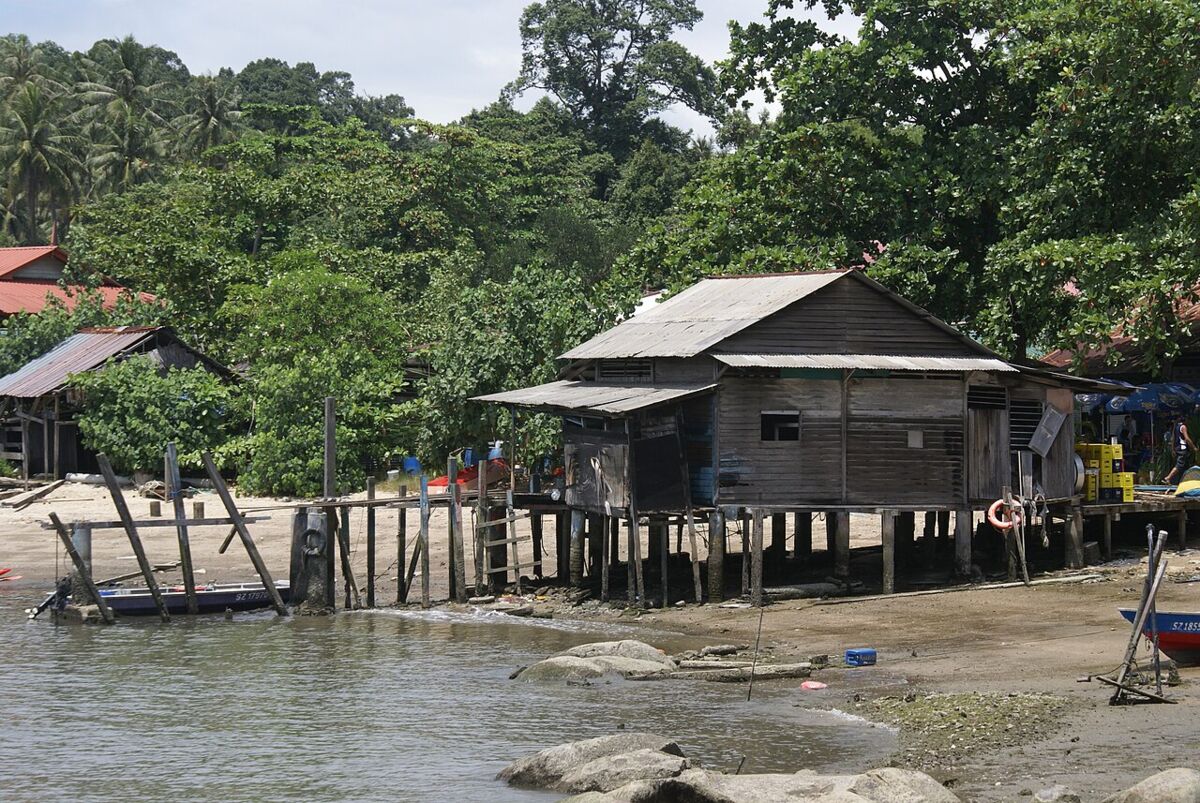 Traditional wooden stilt house on the shore of a fishing village at Pulau Ubin