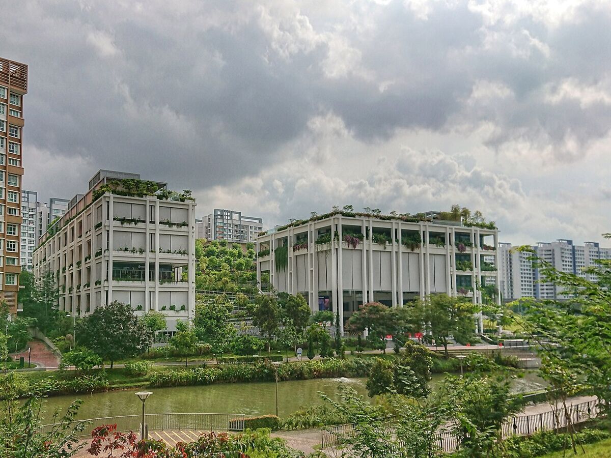 Oasis Terraces community hub with terraced greenery beside the Punggol Waterway