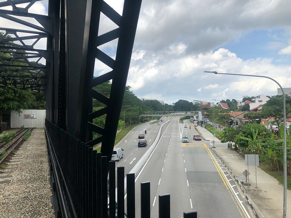 View from the former black steel railway truss bridge over Upper Bukit Timah Road along the Rail Corridor near Rail Mall