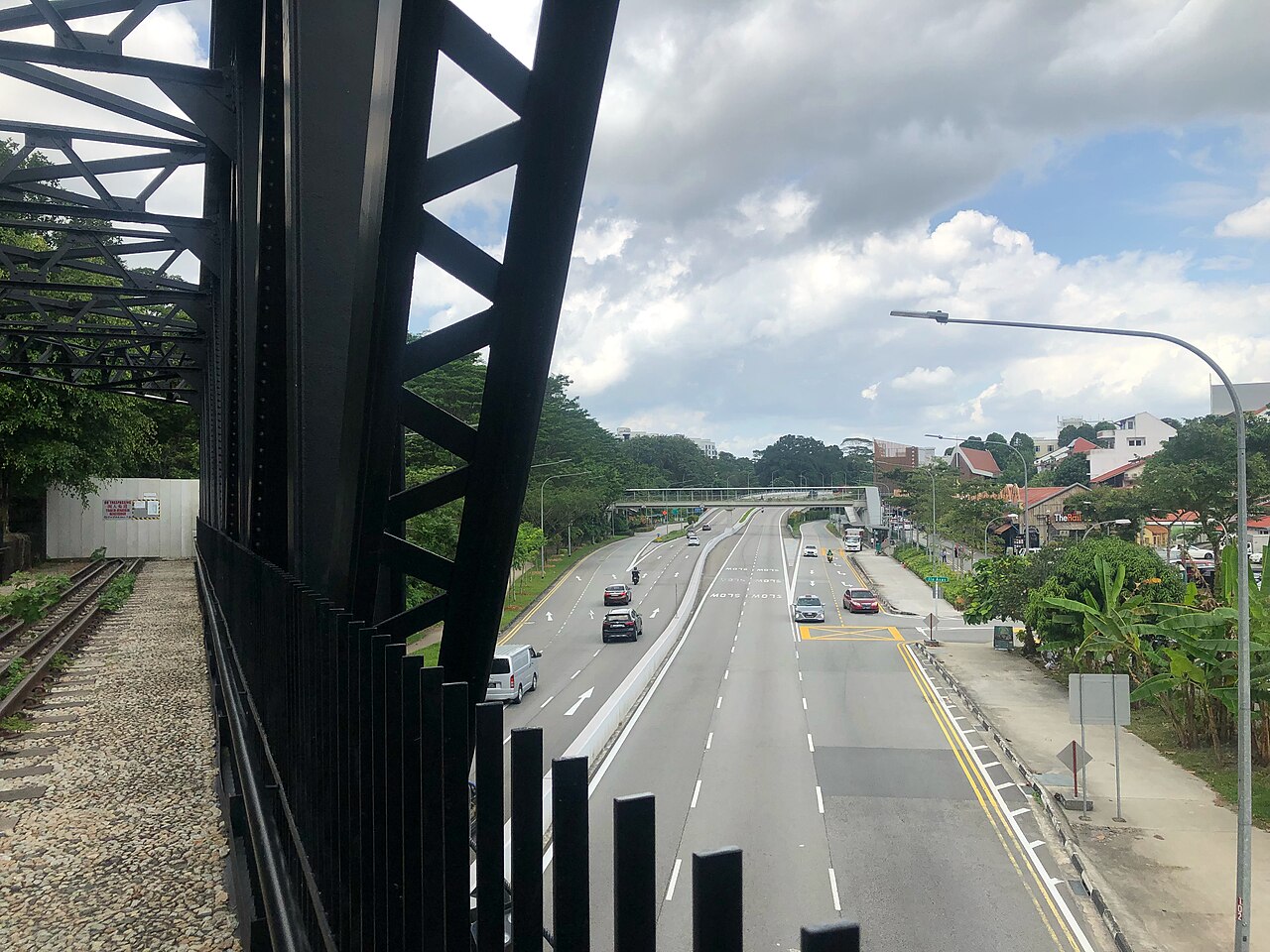 View from the former black steel railway truss bridge over Upper Bukit Timah Road along the Rail Corridor near Rail Mall
