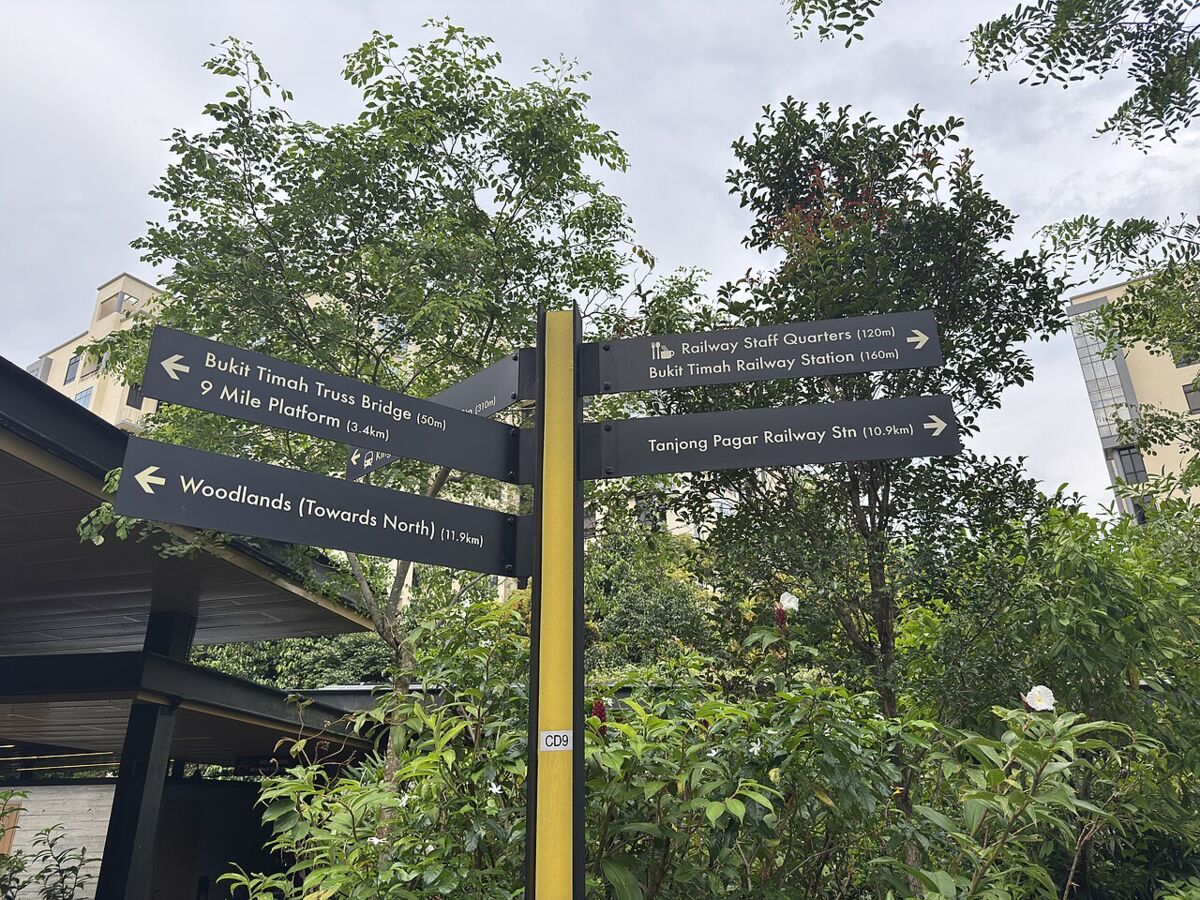 Rail Corridor wayfinding signpost pointing to Bukit Timah Truss Bridge, railway stations and Woodlands