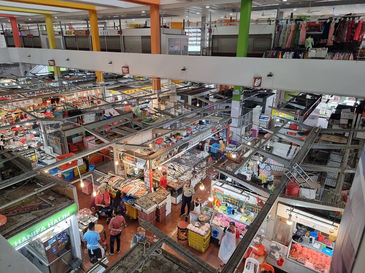 Overhead view of the bustling wet market stalls inside Tekka Centre seen from an upper level