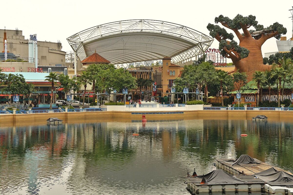 Lake Hollywood amphitheatre stage and giant tree across the central lagoon at Universal Studios Singapore