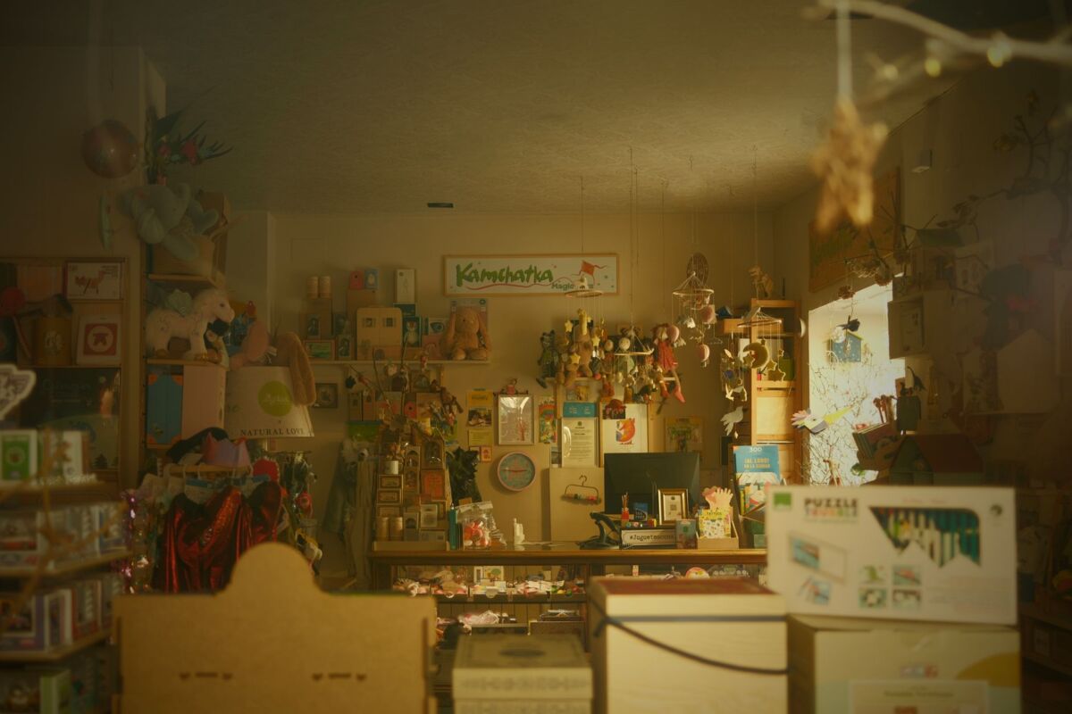 Warm and inviting toy store filled with plush toys, whimsical decor, and colorful displays.